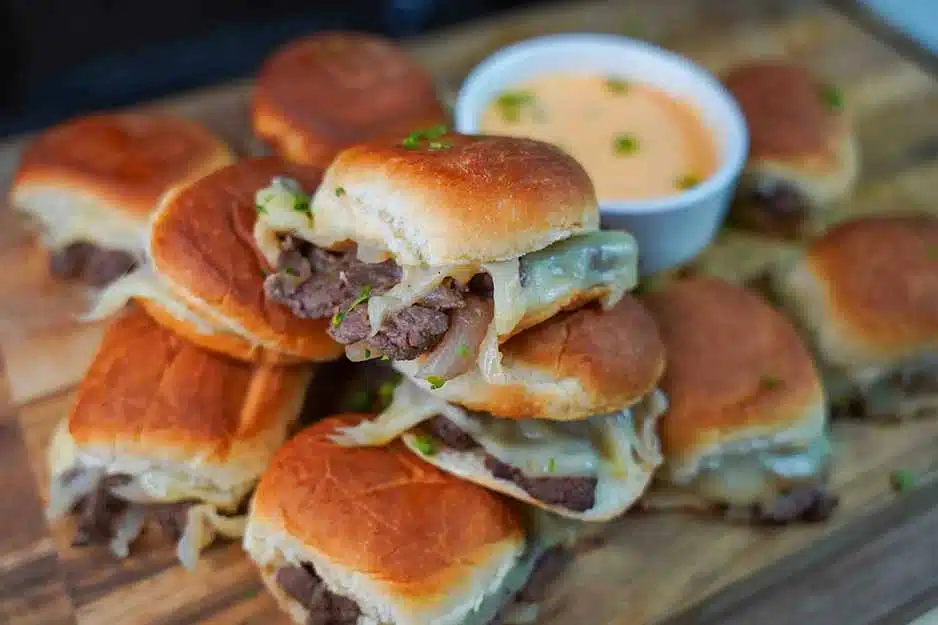 Photo of Cenison Cheesesteak Sliders with dipping sauce.